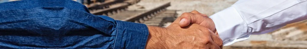 Headerbild mit Händedruck symbolisiert Zusammenarbeit mit SchienenJobs.