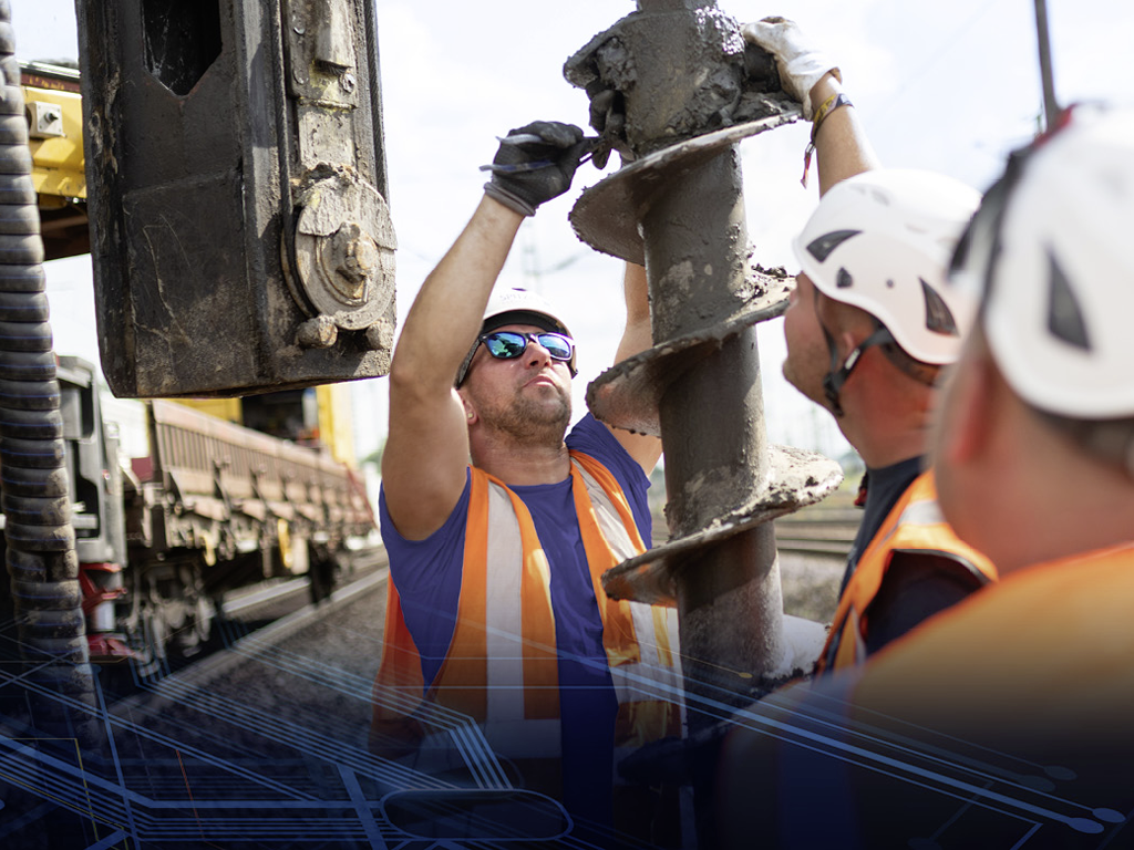 Bauarbeiter Tiefbau beim Bahnbau von Spitzke